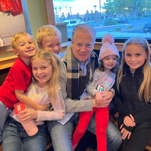 Hughes with his grandchildren. 